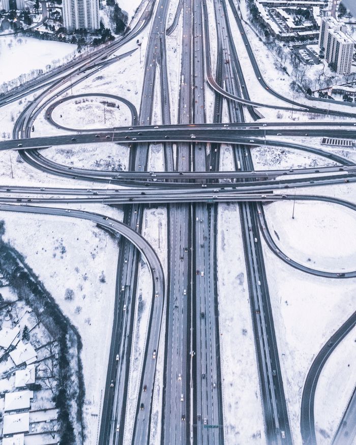 A stunning aerial view of snow-covered multilevel highways in Toronto, Canada.